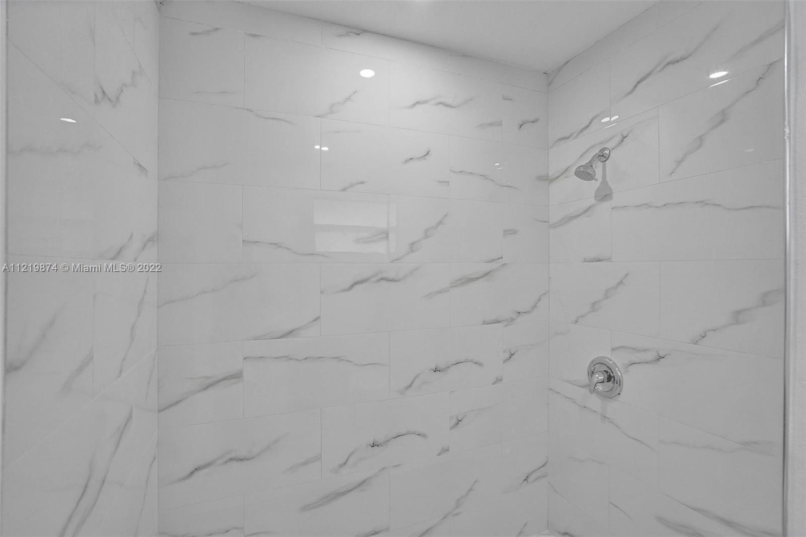 369 Northeast 158th Street Miami, FL 33162 - Photo 24 of 58 a bathroom with shower