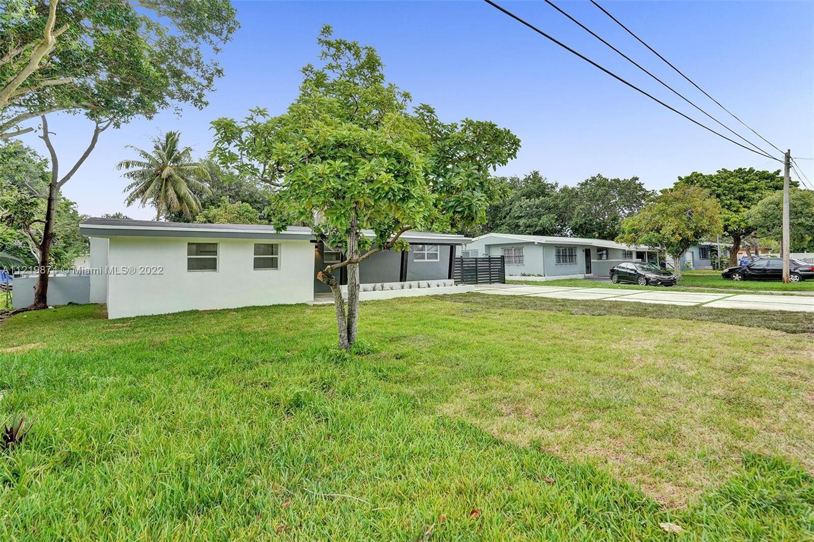 369 Northeast 158th Street Miami, FL 33162 - Photo 3 of 58 a house view with a outdoor space