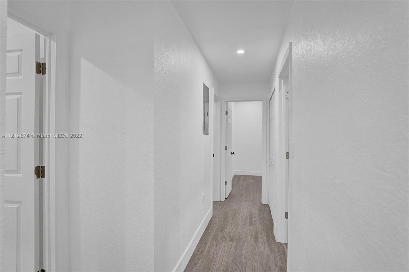 369 Northeast 158th Street Miami, FL 33162 - Photo 35 of 58 a view of a room with wooden floor