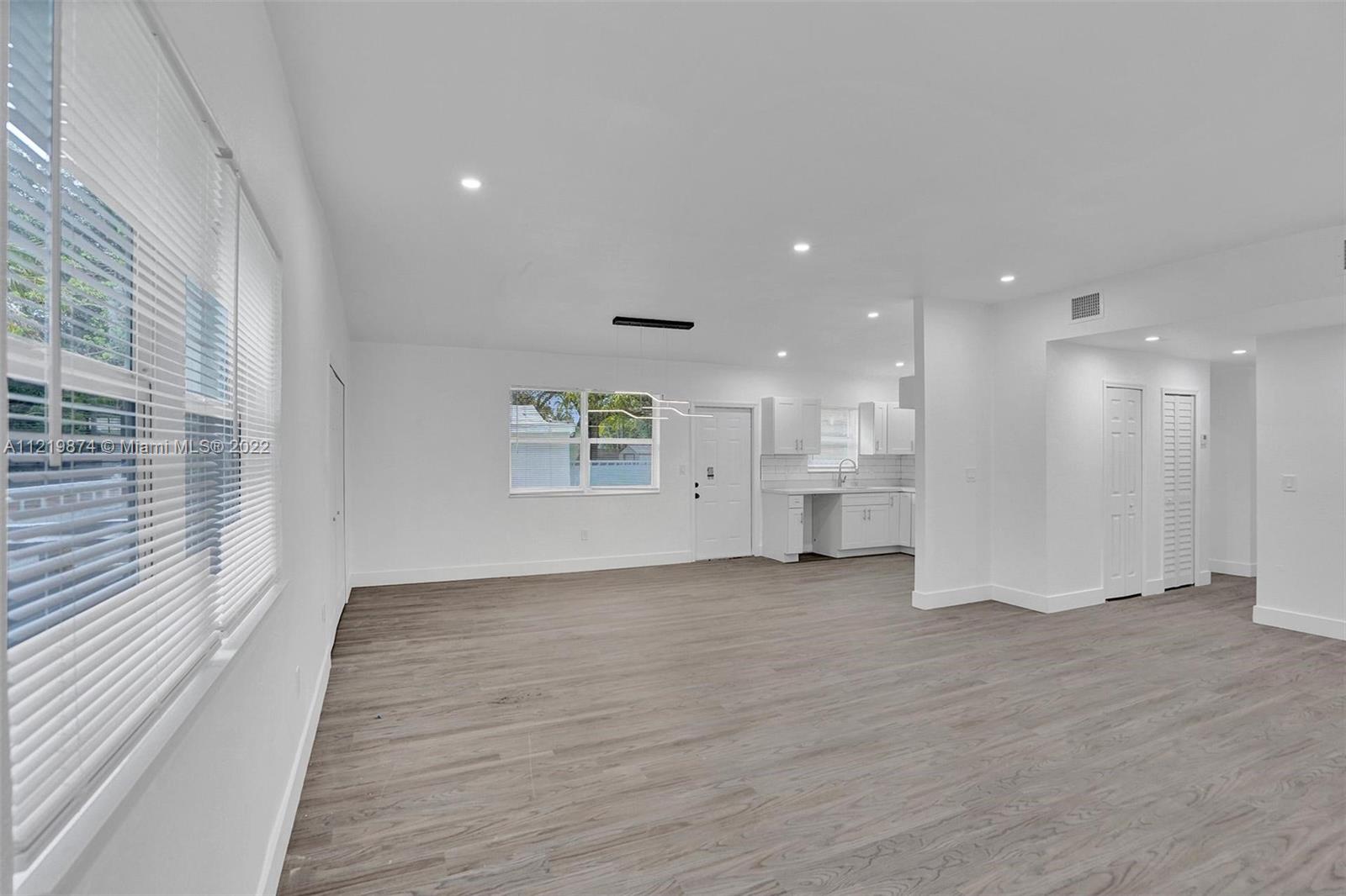 369 Northeast 158th Street Miami, FL 33162 - Photo 47 of 58 a view of an empty room with a window