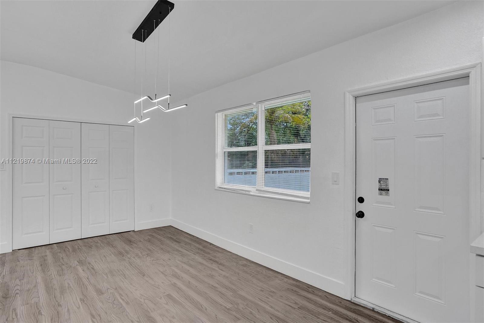 369 Northeast 158th Street Miami, FL 33162 - Photo 55 of 58 a view of an empty room with a window