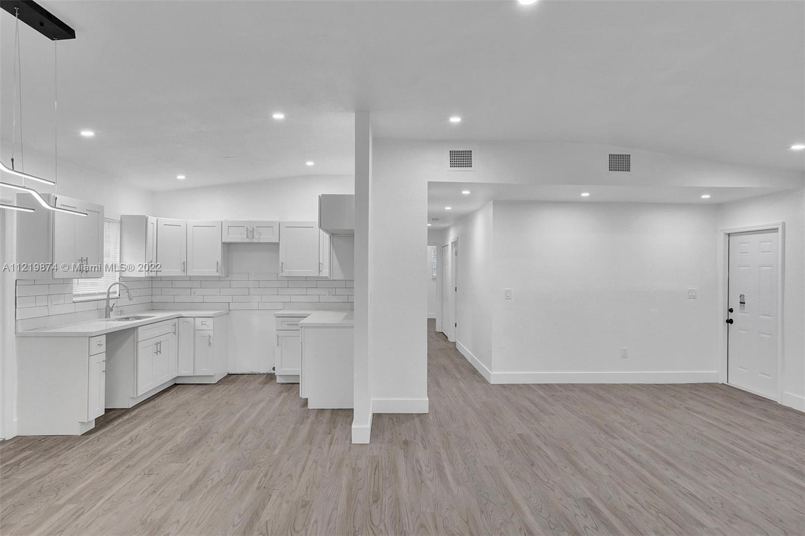 369 Northeast 158th Street Miami, FL 33162 - Photo 58 of 58 a view of kitchen with wooden floor