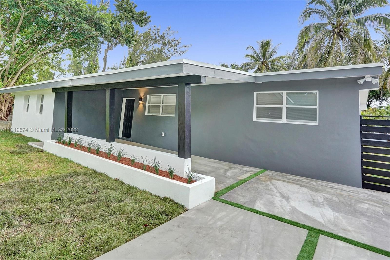 369 Northeast 158th Street Miami, FL 33162 - Photo 6 of 58 a house with a outdoor space