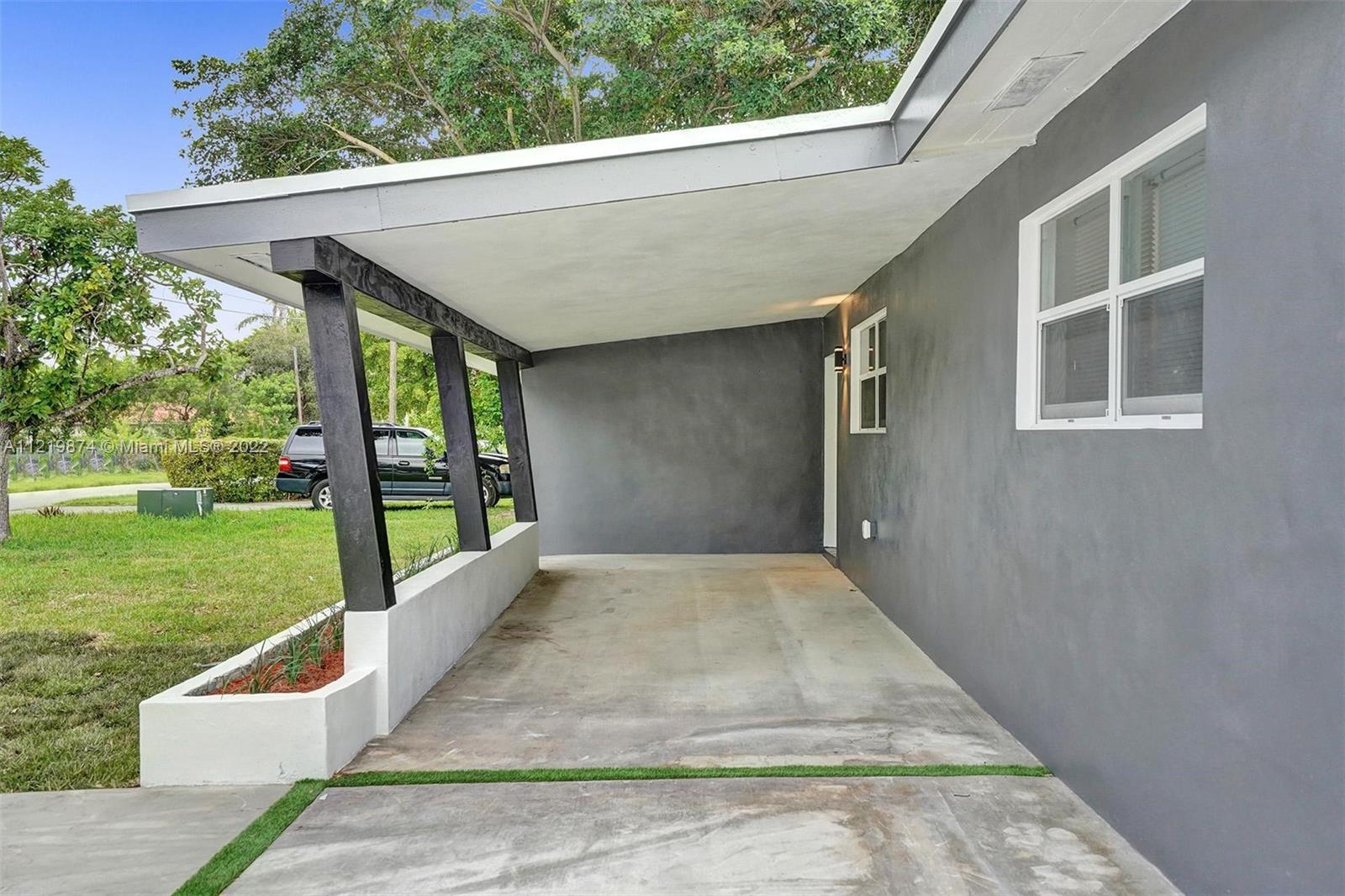 369 Northeast 158th Street Miami, FL 33162 - Photo 7 of 58 a view of outdoor space yard and front view of a house