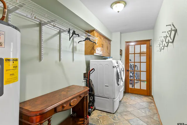 a view of storage and utility room with racks on the wall