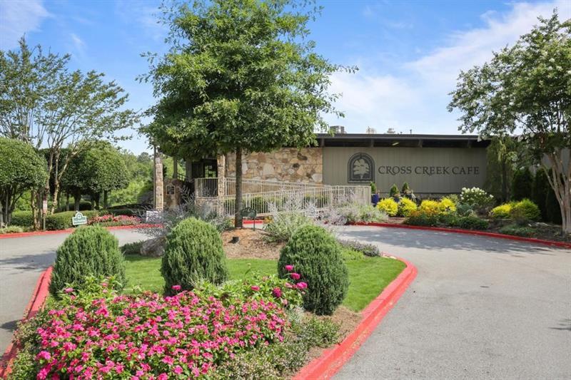8 Arpege Way Northwest Atlanta, GA 30327 - Photo 26 of 36 a front view of a house with a yard and fountain