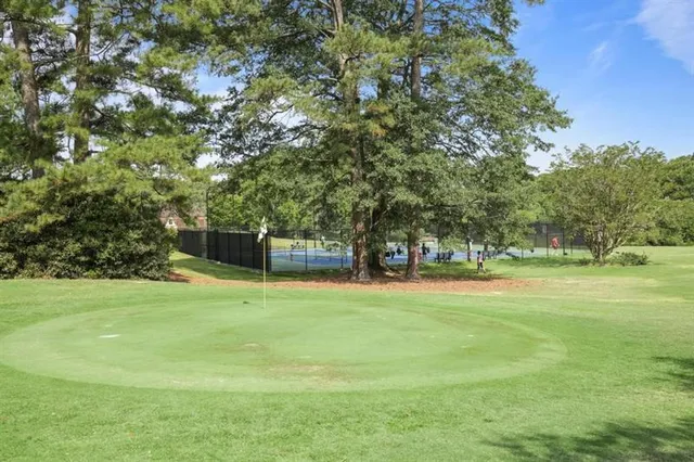 a view of a trees and basketball court