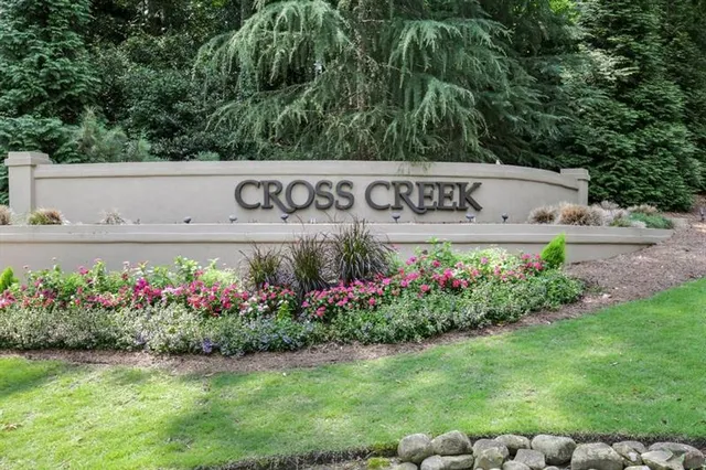 a sign that is sitting on a wooden floor