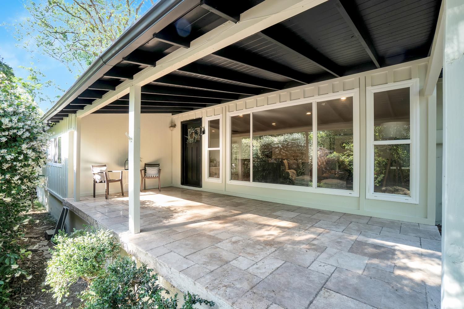 6299 Horseshoe Bar Road Loomis, CA 95650 - Photo 39 of 43 a view of porch with a table and chairs and floor to ceiling window