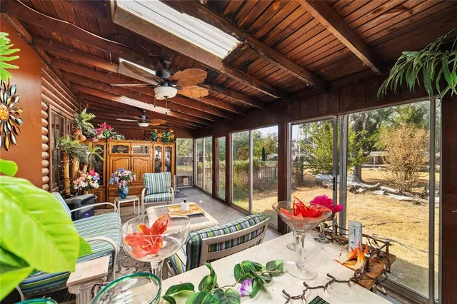 a view of a backyard with sitting area
