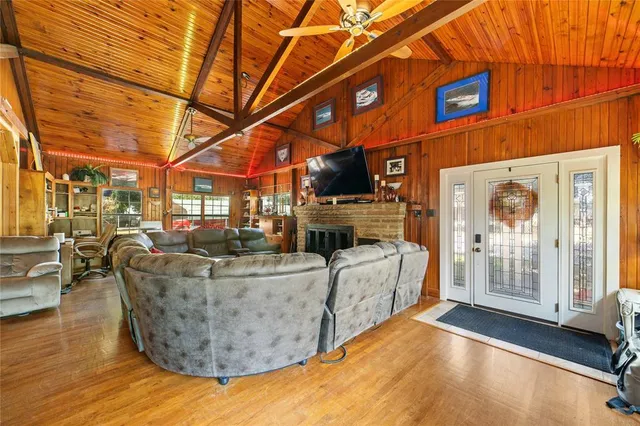 a bedroom with a bed dresser and a flat screen tv