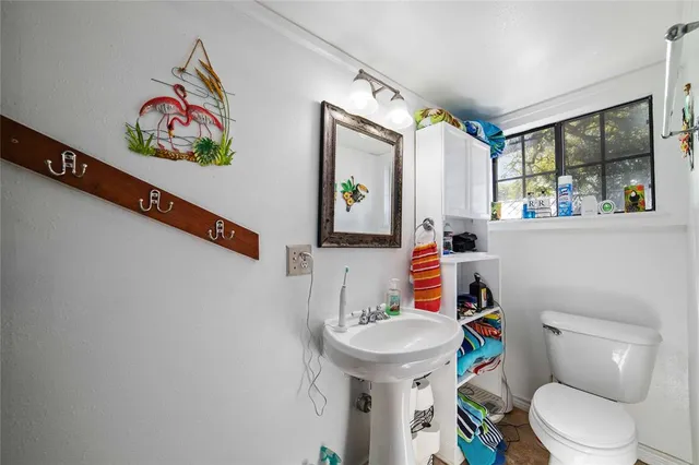 a kitchen with granite countertop a sink and cabinets