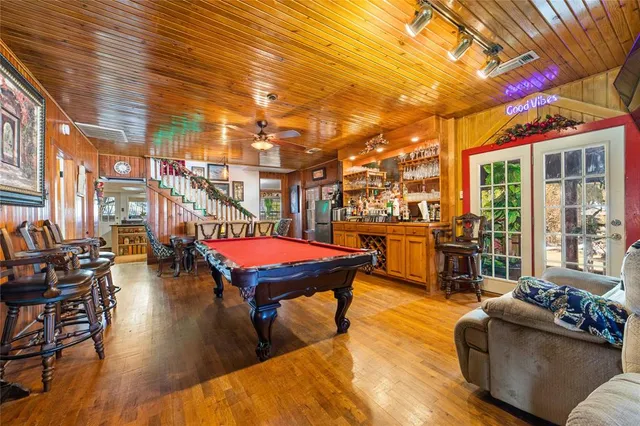 a couch sitting in a patio with a potted plant