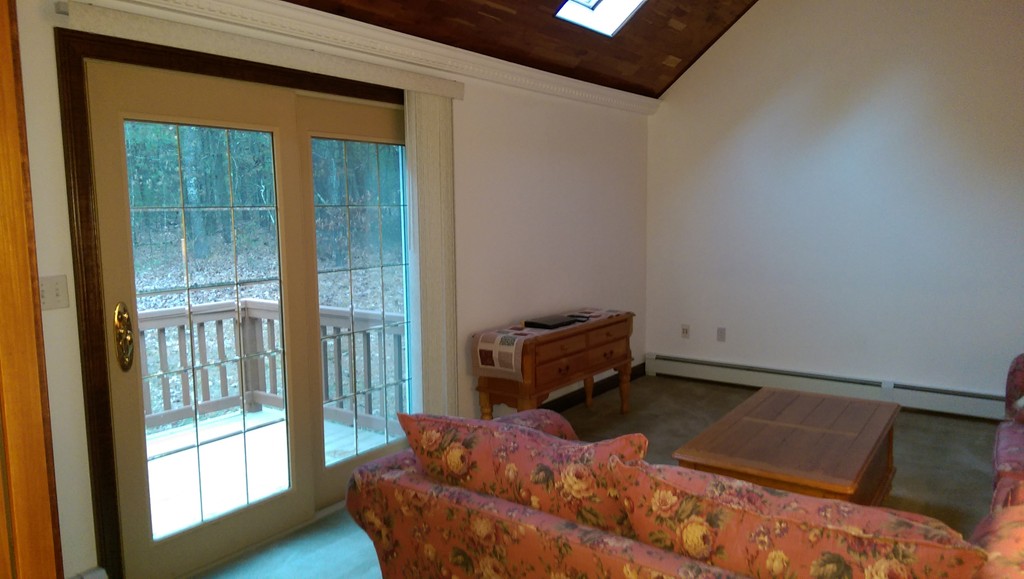 82 Walker Road Shirley, MA 01464 - Photo 17 of 27 a bedroom with a bed and large window
