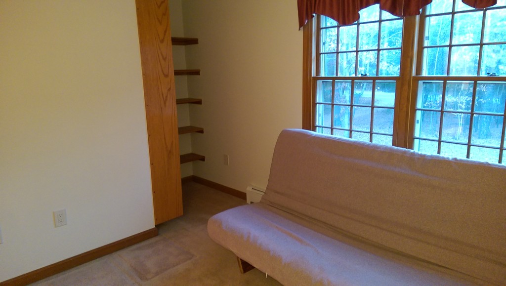 82 Walker Road Shirley, MA 01464 - Photo 23 of 27 a room with chair and table