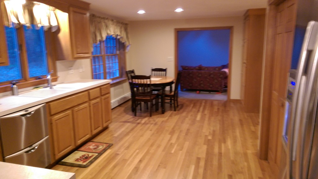 82 Walker Road Shirley, MA 01464 - Photo 6 of 27 a kitchen with stainless steel appliances granite countertop a refrigerator a sink dishwasher a dining table and chairs with wooden floor
