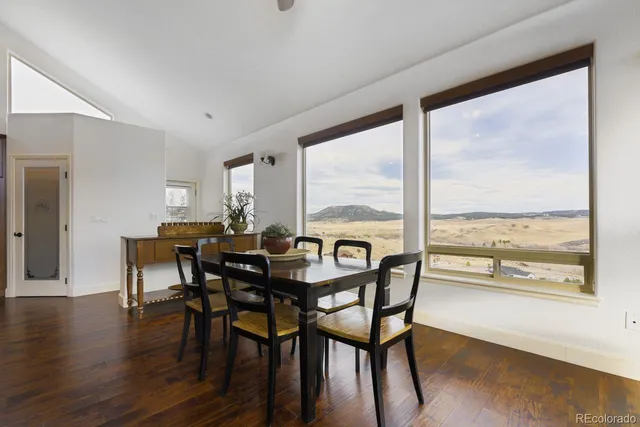 a kitchen with stainless steel appliances granite countertop a stove a refrigerator and a wooden floors