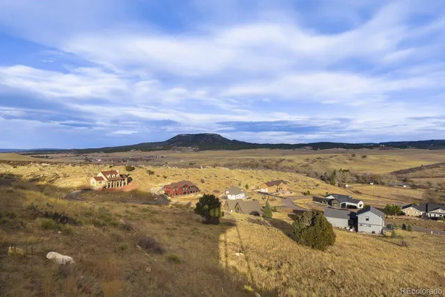 a house with trees in the background