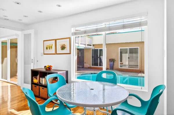 a living room with furniture and kitchen view
