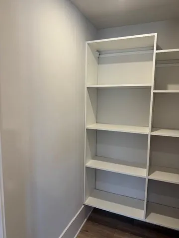 a view of an empty walk in closet