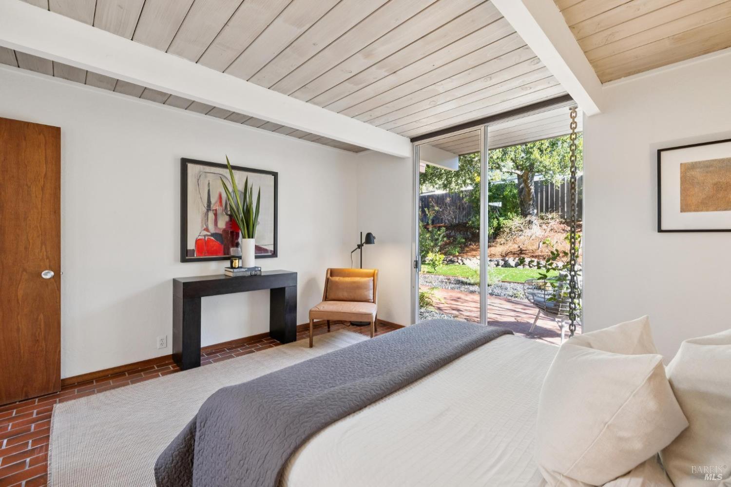 1200 Idylberry Road San Rafael, CA 94903 - Photo 30 of 58 a bedroom with a bed and a dresser next to a window