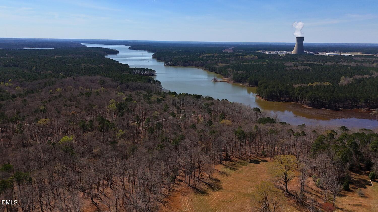 4321-4333 New Hill Holleman Road Apex, NC 27539 - Photo 5 of 8 a view of a lake with beach and green space