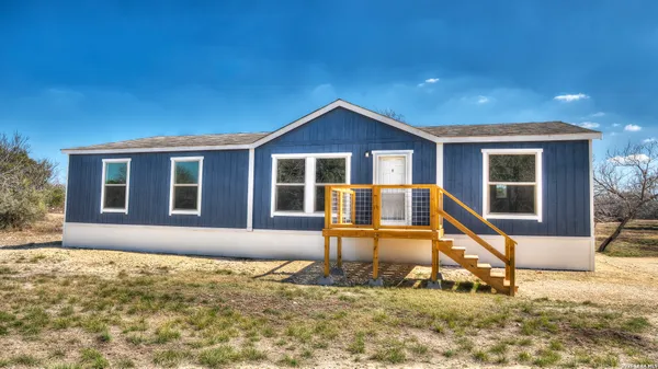 a house view with a garden space