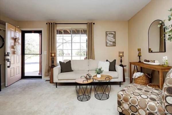 a living room with furniture and a window