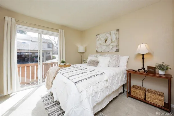 a view of a bedroom with washer and dryer