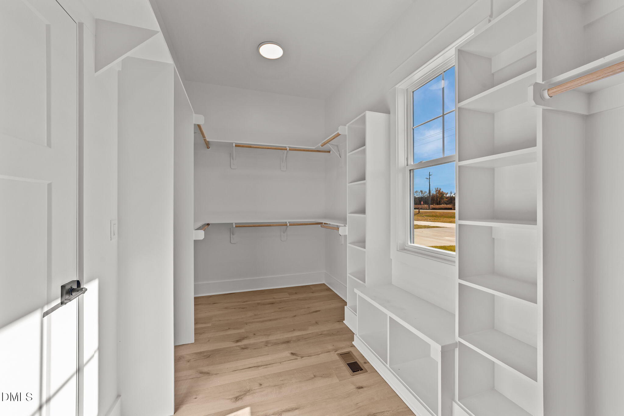 2568 Lassiter Road Four Oaks, NC 27524 - Photo 25 of 50 a view of an empty walk in closet