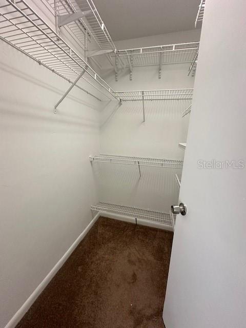 3031 Southwest Archer Road, Unit 2A Gainesville, FL 32608 - Photo 7 of 10 a view of a room with racks on the wall