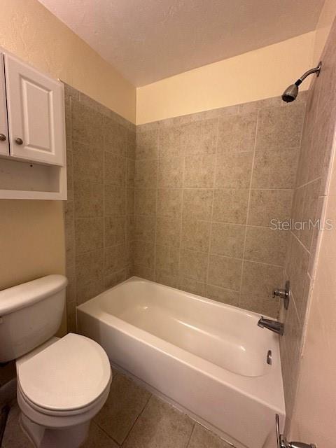 3031 Southwest Archer Road, Unit 2A Gainesville, FL 32608 - Photo 8 of 10 a bathroom with a toilet and a bathtub