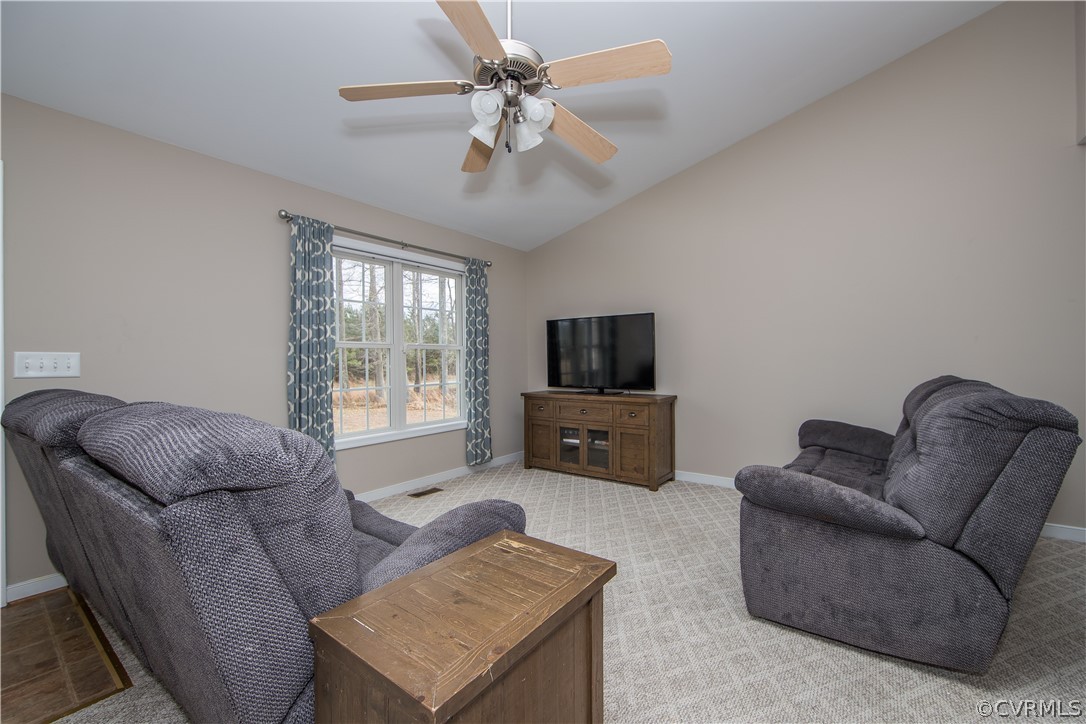 8350 Rowanty Road Carson, VA 23830 - Photo 8 of 25 a living room with furniture a flat screen tv and a window