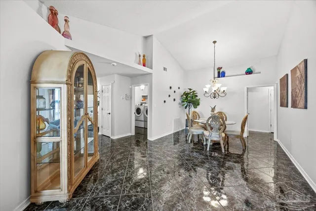 a view of a livingroom with furniture and window