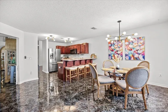 a view of a dining room with furniture
