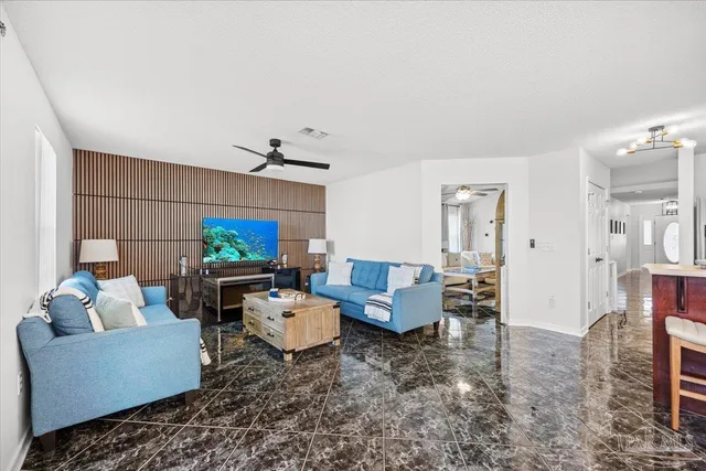 a living room with furniture and a fireplace
