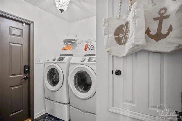 a utility room with dryer and washer