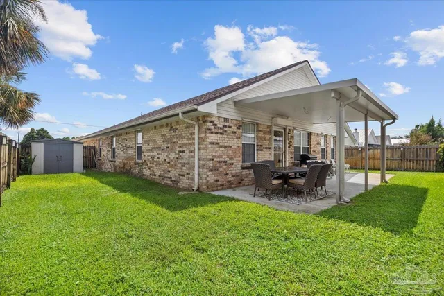 a view of a backyard with a patio
