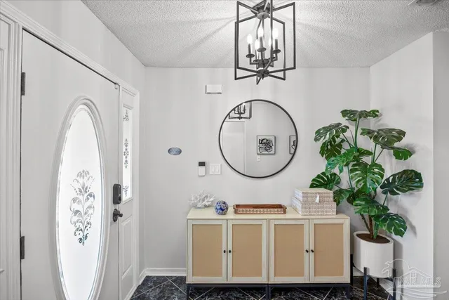 a bathroom with a sink a mirror and a clock on the wall