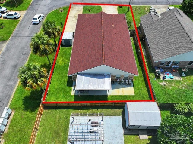 an aerial view of pool and yard