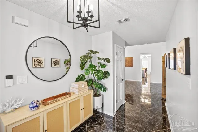 a picture of a room with painting on the wall