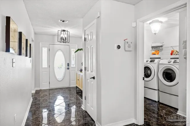 a view of a utility room with washer and dryer