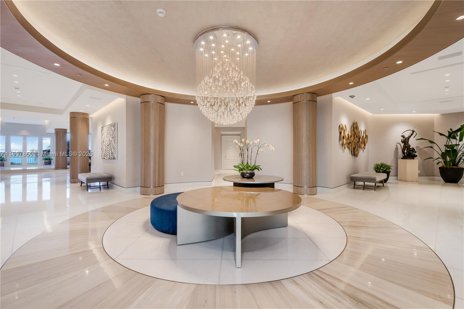 888 Brickell Key Drive, Unit 2610 Miami, FL 33131 - Photo 24 of 37 a living room with couches a table and chairs