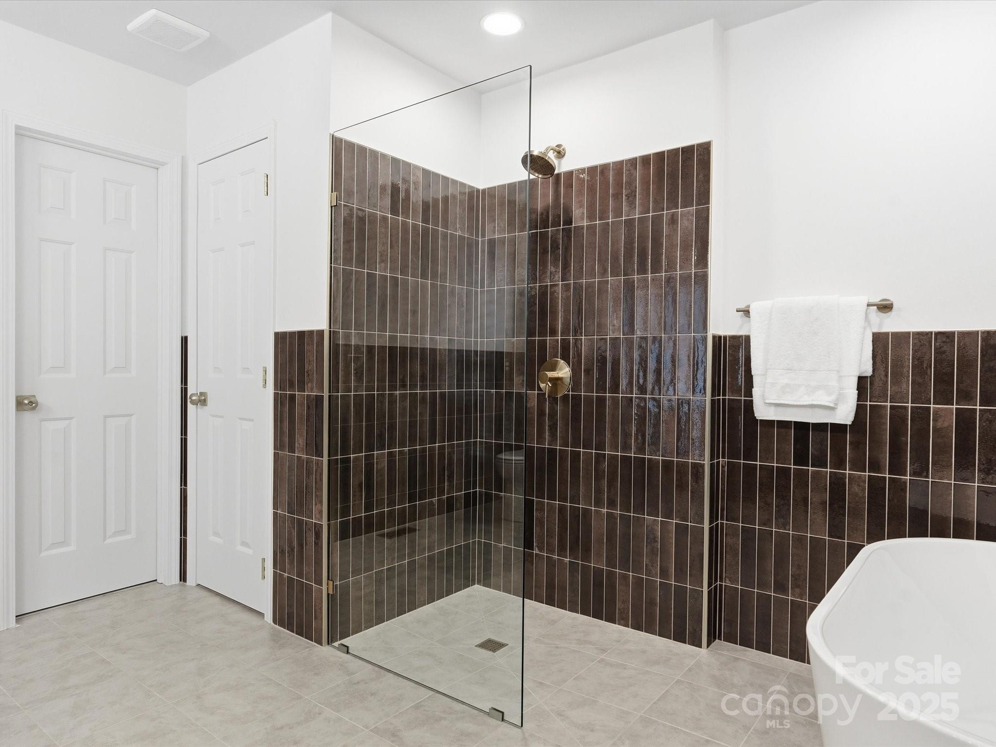 3909 Brownes Ferry Road Charlotte, NC 28269 - Photo 20 of 47 a bathroom with a shower