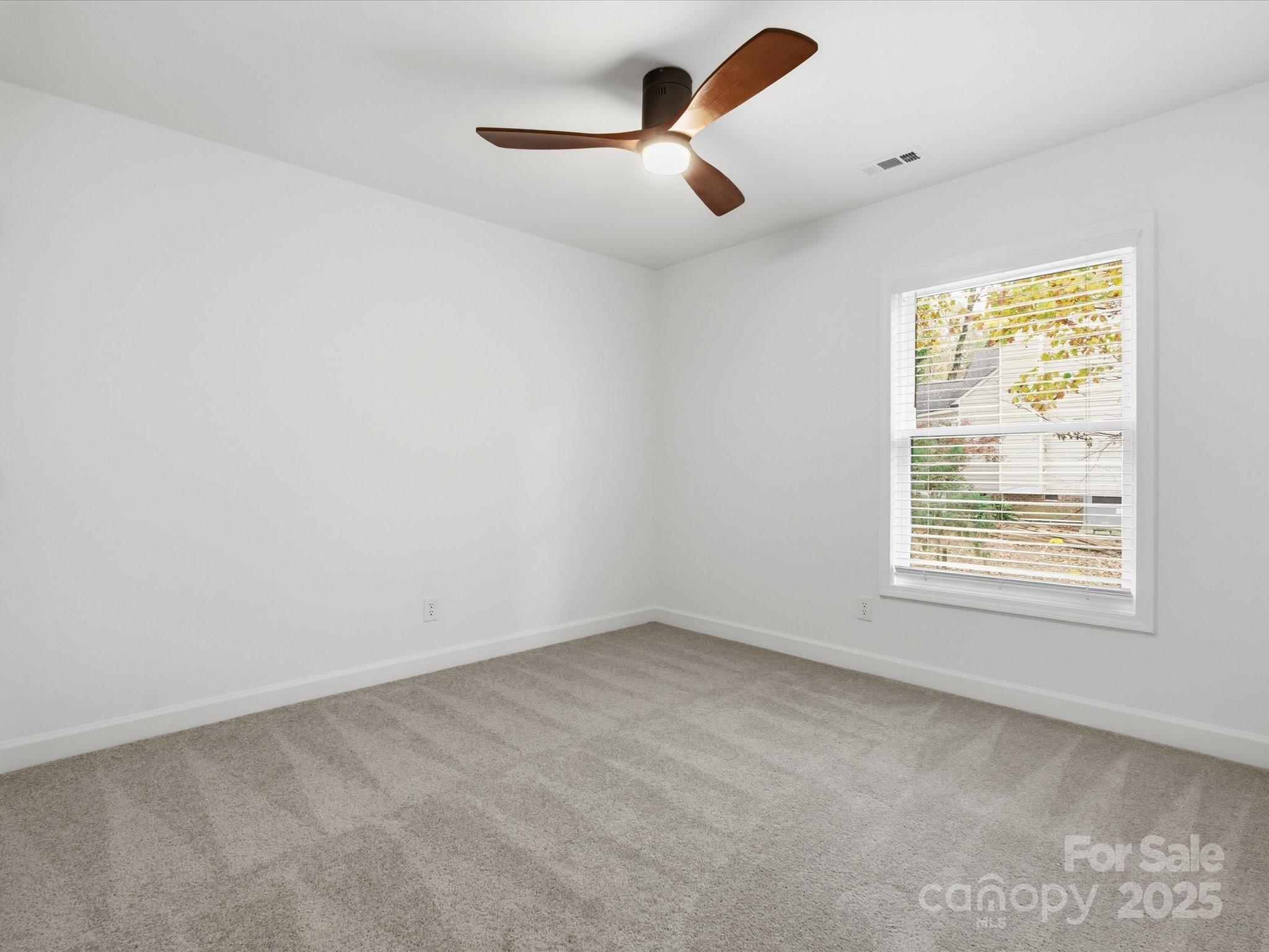 3909 Brownes Ferry Road Charlotte, NC 28269 - Photo 25 of 47 an empty room with a window