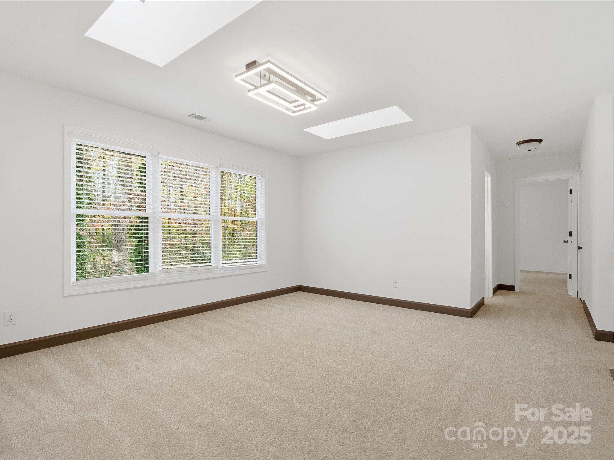 3909 Brownes Ferry Road Charlotte, NC 28269 - Photo 26 of 47 an empty room with windows