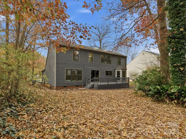 a house that has a tree in front of it
