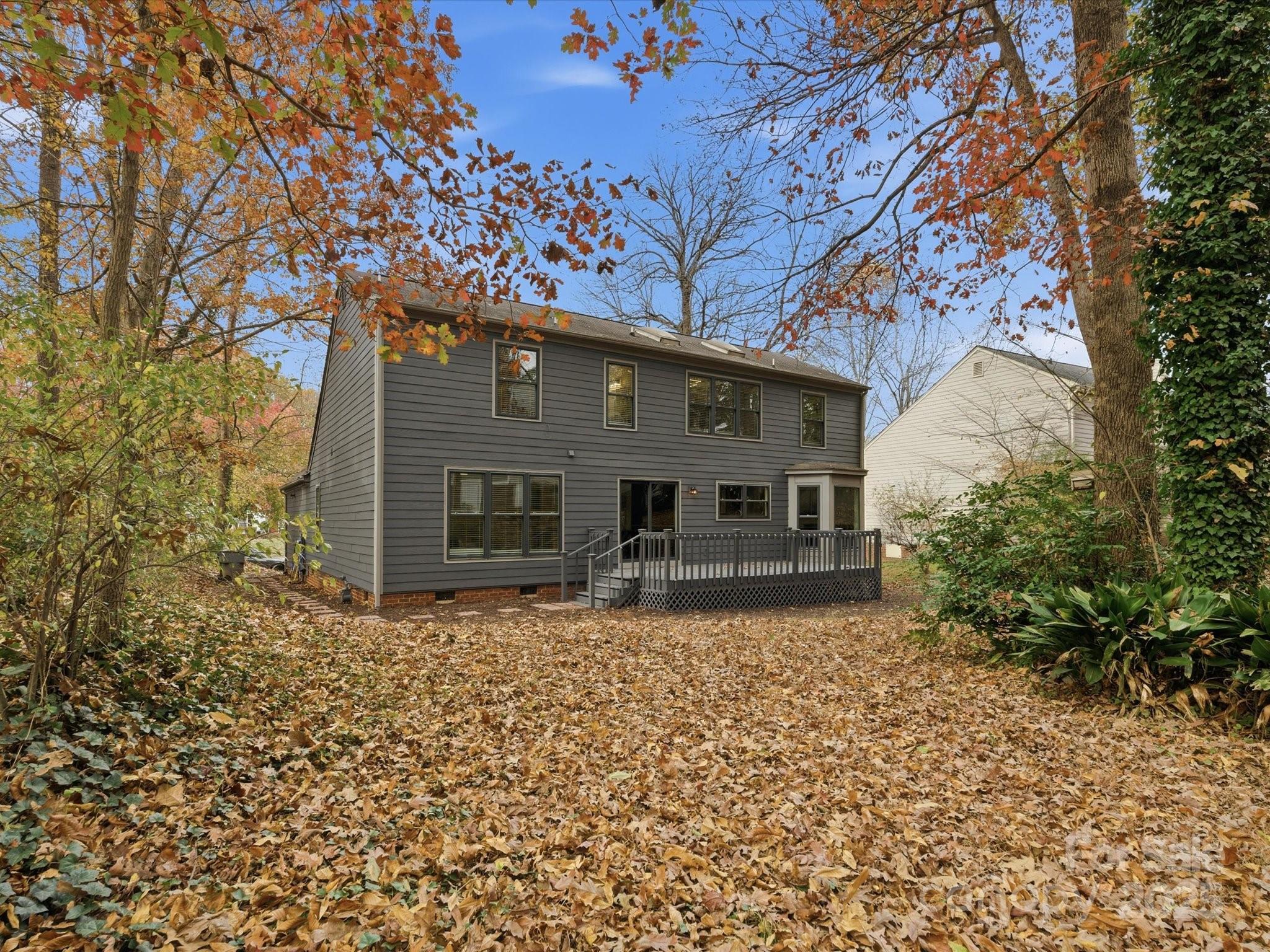 3909 Brownes Ferry Road Charlotte, NC 28269 - Photo 35 of 47 a house that has a tree in front of it