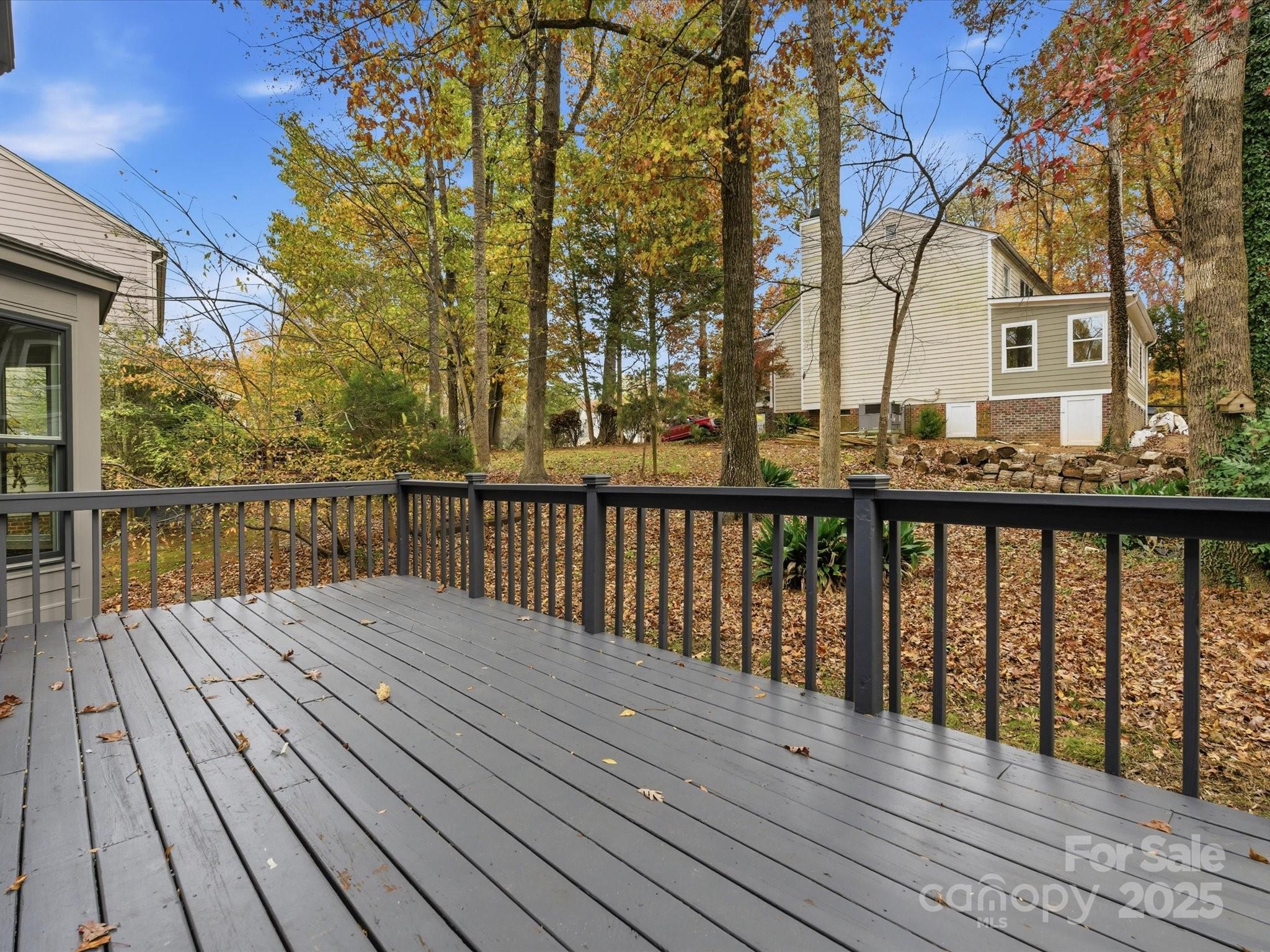 3909 Brownes Ferry Road Charlotte, NC 28269 - Photo 37 of 47 a view of wooden balcony with wooden floor and fence