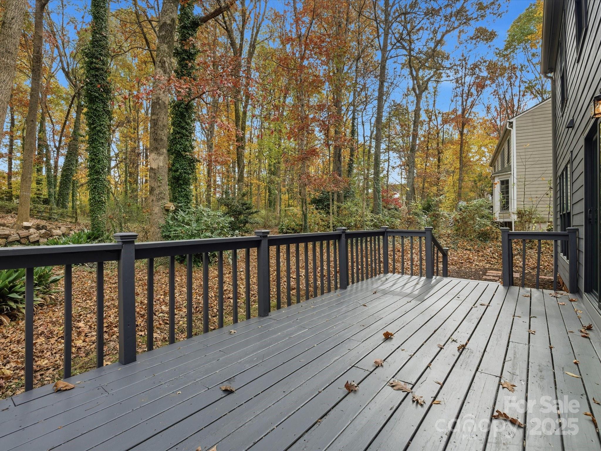 3909 Brownes Ferry Road Charlotte, NC 28269 - Photo 38 of 47 a balcony with wooden floor and trees